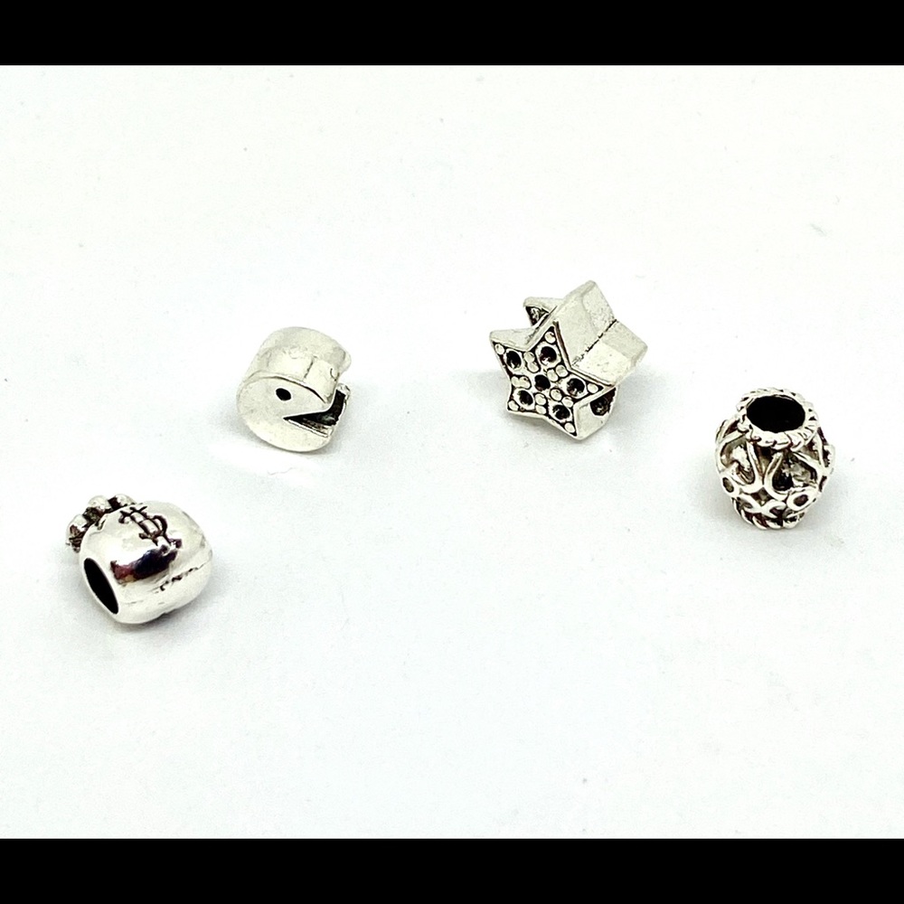 4 Pandora-like sterling silver European beads.